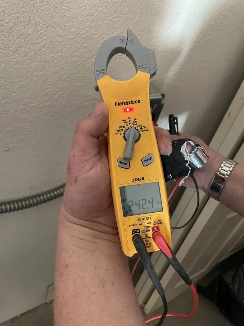Voltage testing with clamp meter during Electrical Installation Services in Seymour